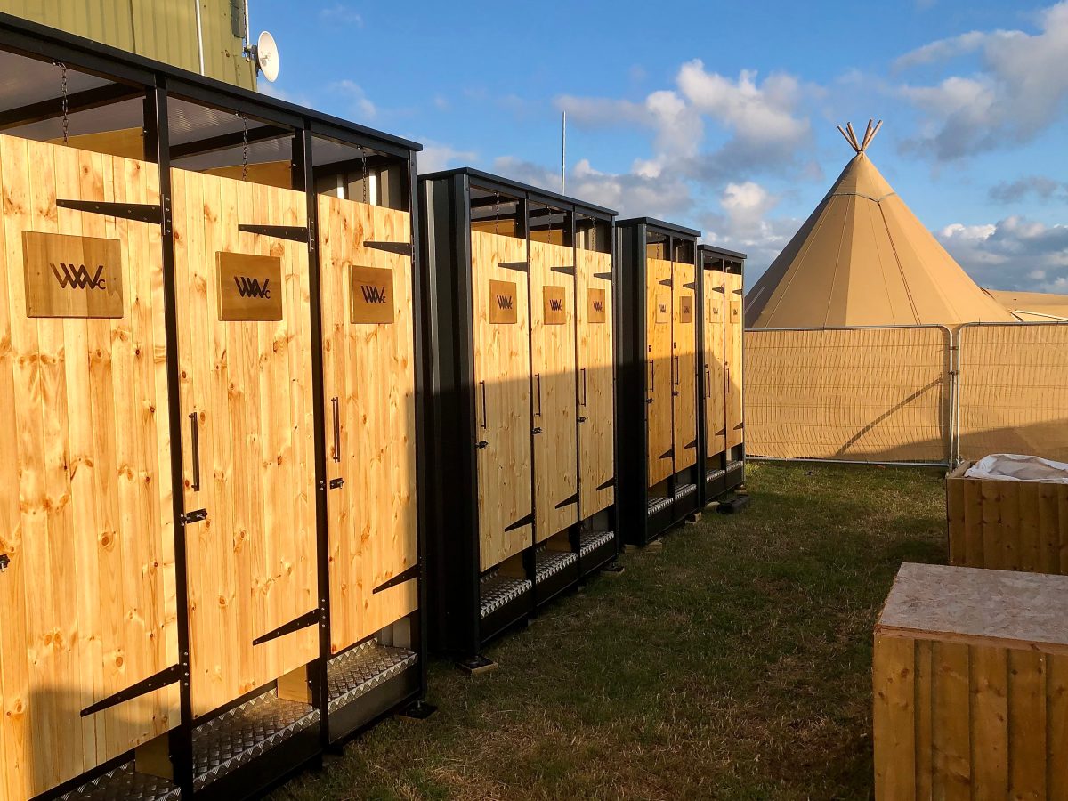 Image showcasing Eco-Friendly Compost Toilets for Festivals – Wild Willy Cabins